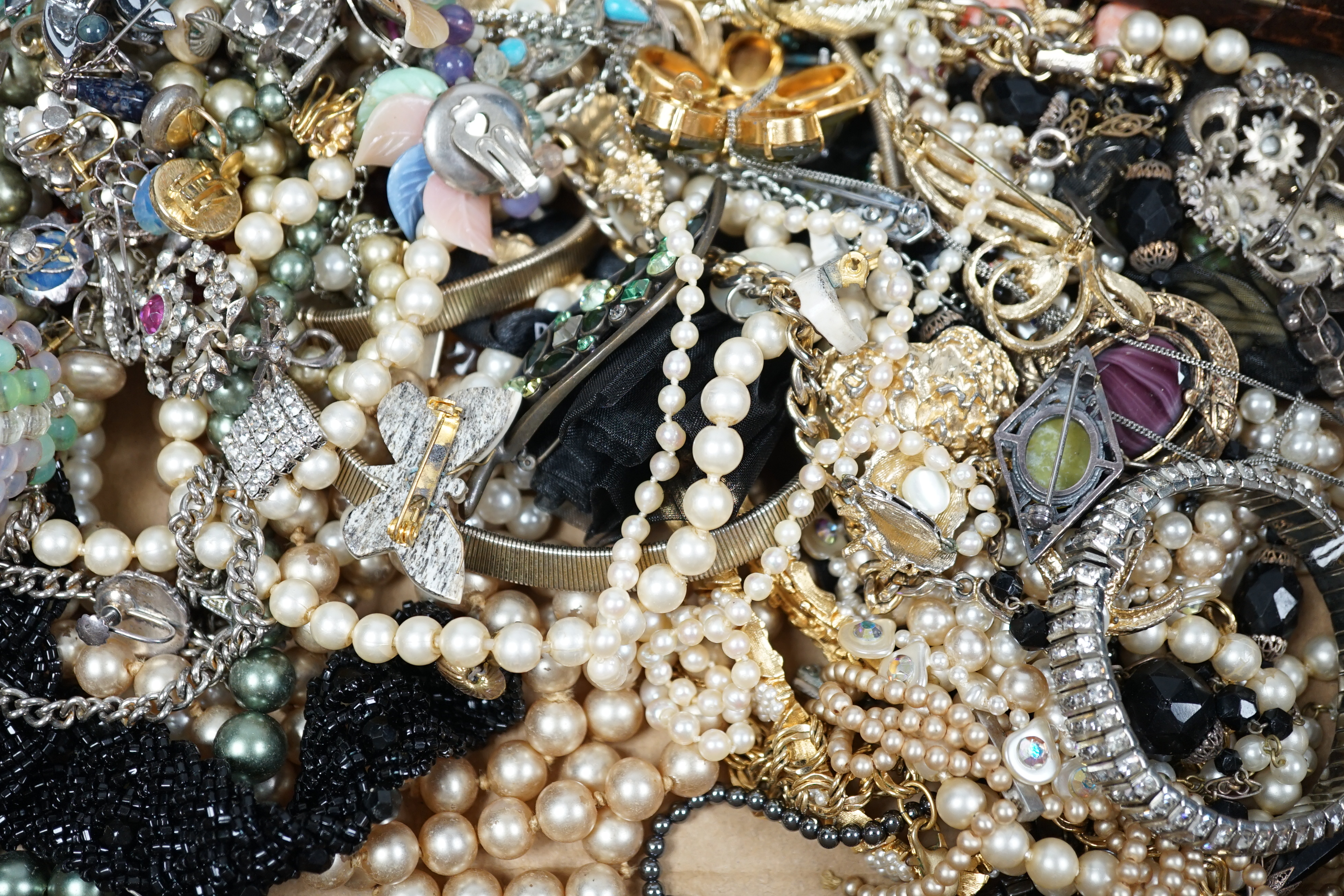 A quantity of assorted costume jewellery including cultured pearl necklace and rock crystal? cross pendant.